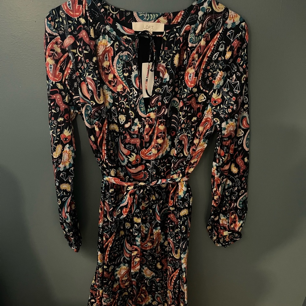 Light weight fun pattern dress. Never worn.